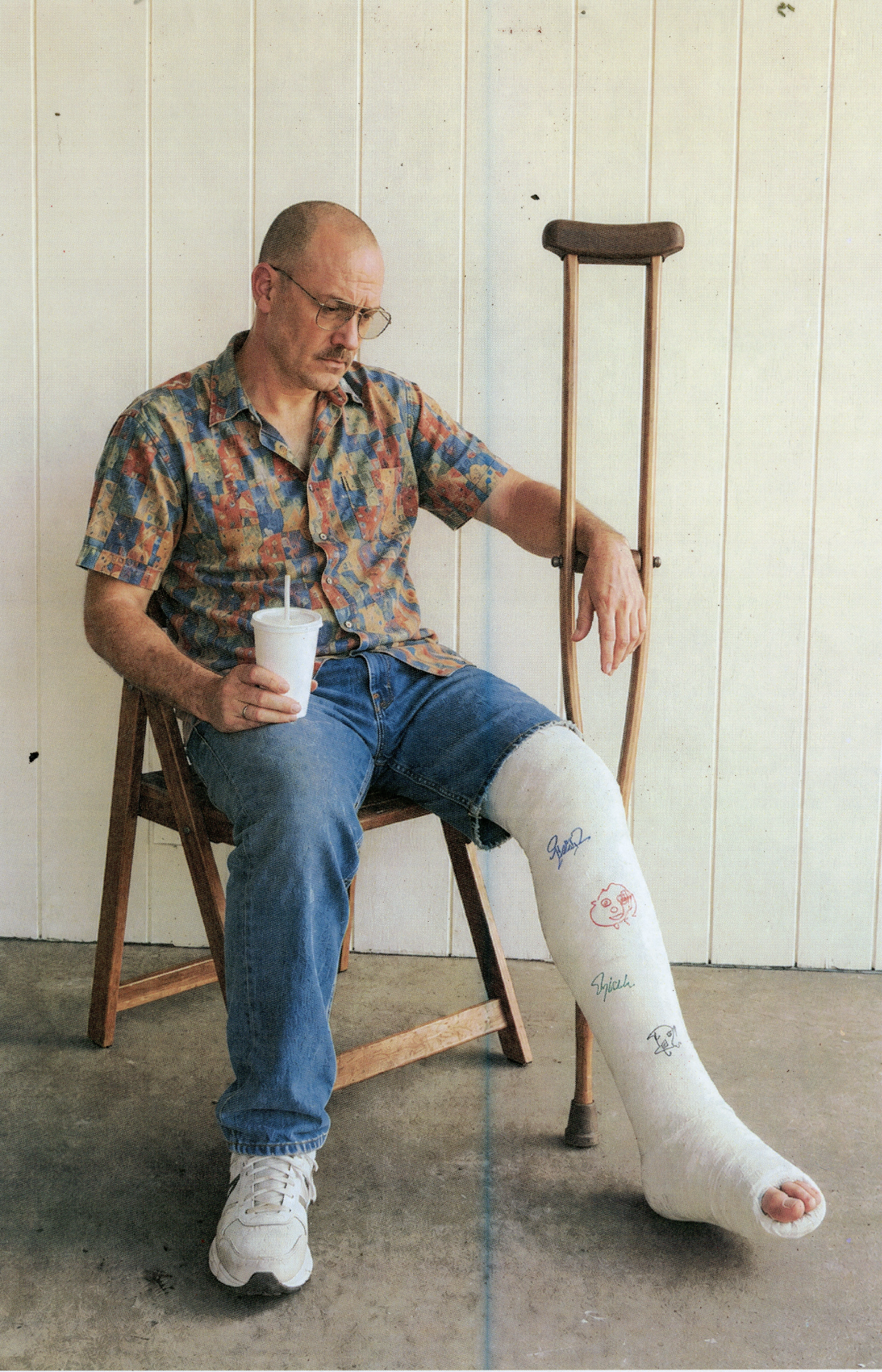 LT-003 Man Seated with Leg Cast and Crutch